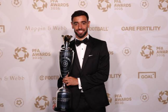 Bruno Fernandes holding his PFA Player of the Year trophy.