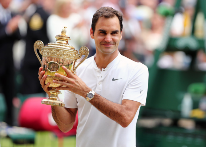 Federer celebrating one of his 8 Wimbledon titles.