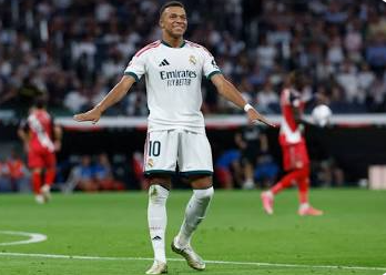 Kylian Mbappé driving forward during transition play.