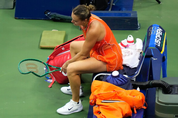 Sabalenka seated near her damaged racket during the final set.