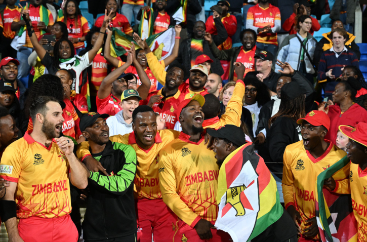 Zimbabwe players celebrate their hard-fought victory over host nation Namibia.